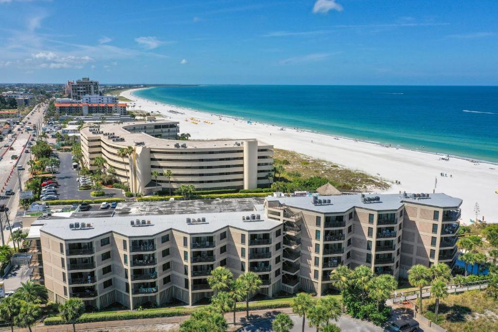 an aerial view of a beach and buildings at Gulf Strand Resort by Travel Resort Services in St. Pete Beach