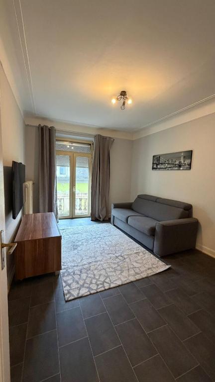 a living room with a couch and a table at Leo, apartment in Wasserbillig