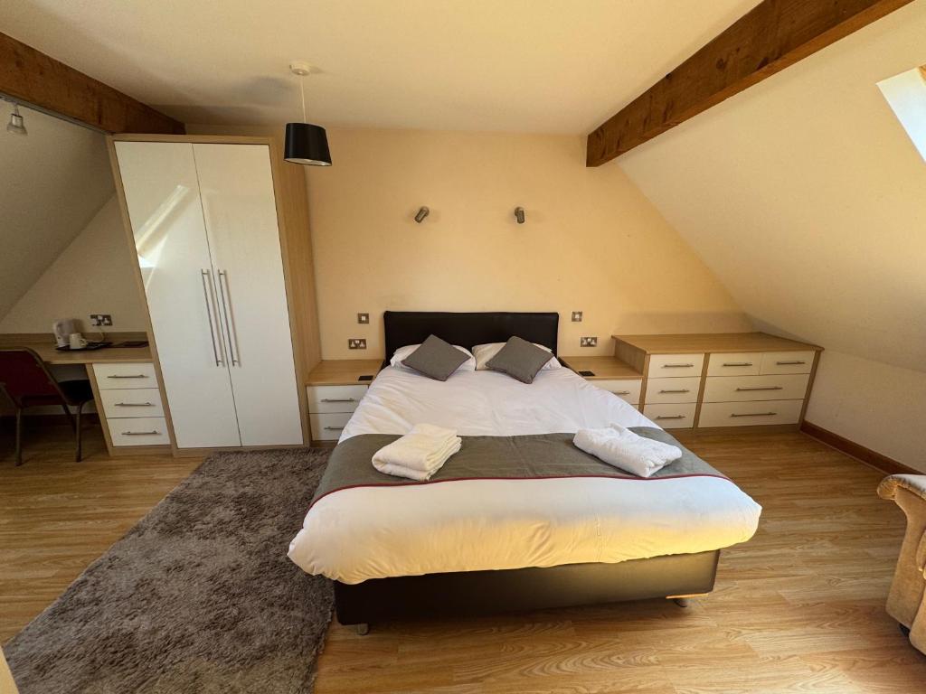 a bedroom with a large bed in a attic at The Clubhouse in Sheffield