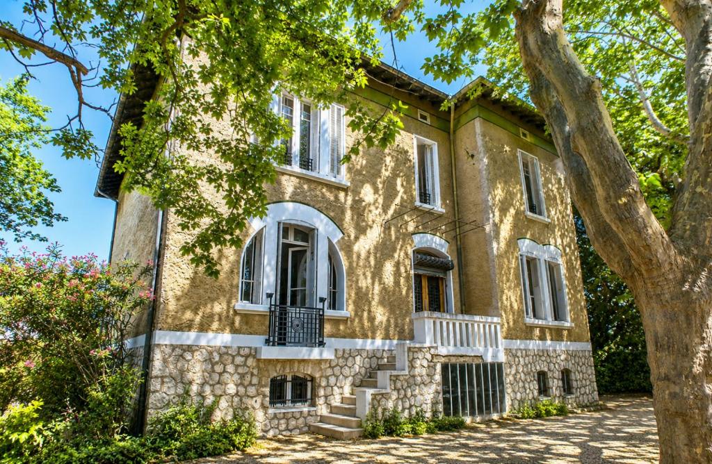 an old stone house with trees in front of it at Chambre dans villa privée, charme et confort proche Vélodrome & plages - Parking privé in Marseille