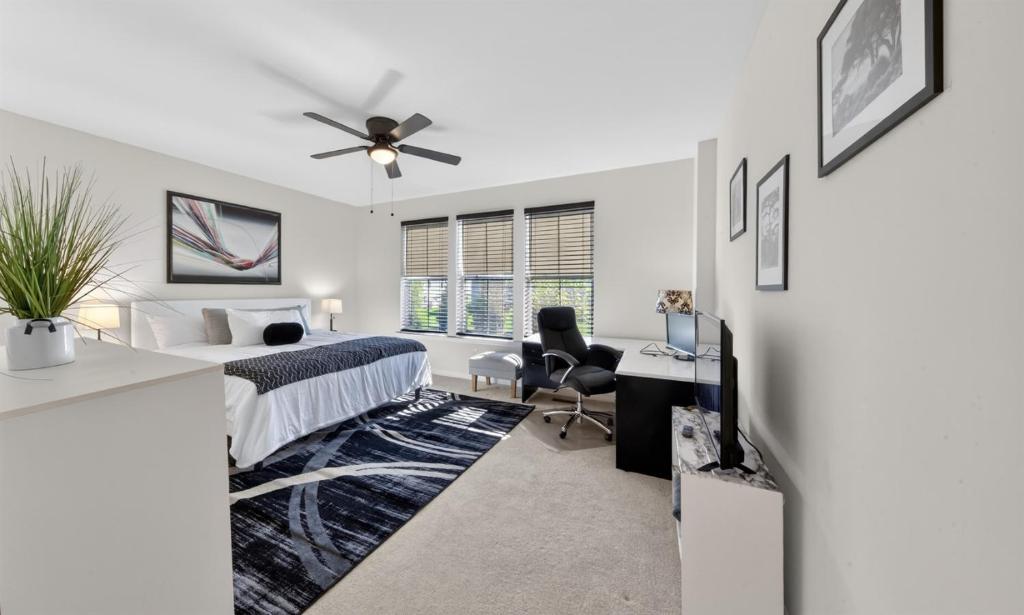 a bedroom with a bed and a ceiling fan at Spacious Family Gathering Space Privacy Zones Quiet, Convenient Neighborhood in Middletown