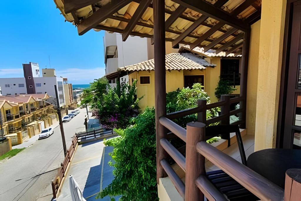 a balcony with a view of a street at Villa Garoupeta in Bombinhas
