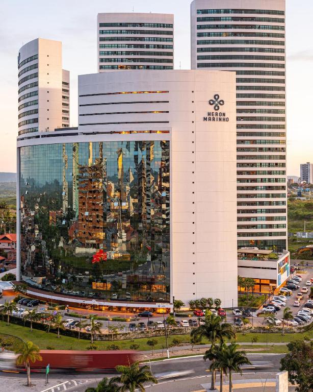 a building with a painting of a city on it at Heron Marinho Comfort Flat in Campina Grande