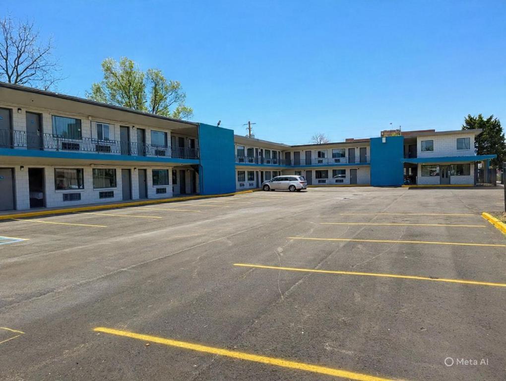 an empty parking lot in front of a building at BlissPoint Inn Muncie in Muncie