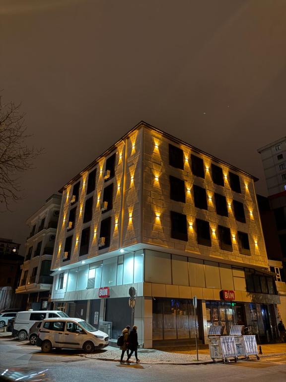 a building with people walking in front of it at Twelve Diamond Hotel in Istanbul