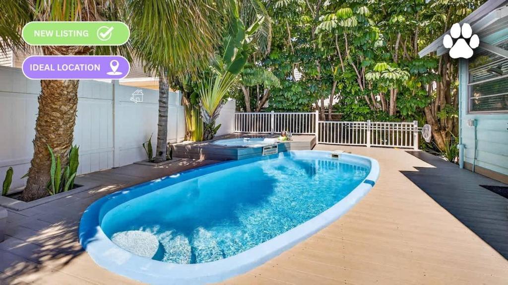a swimming pool in the backyard of a house at Coastal Beach Retreat in Clearwater Beach