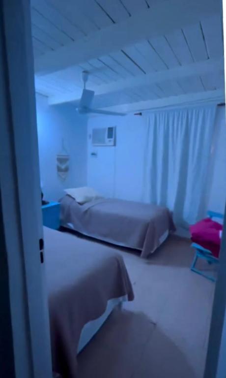 a room with two beds in a hospital room at Casa tranquila Paso de la Patria in Paso de la Patria