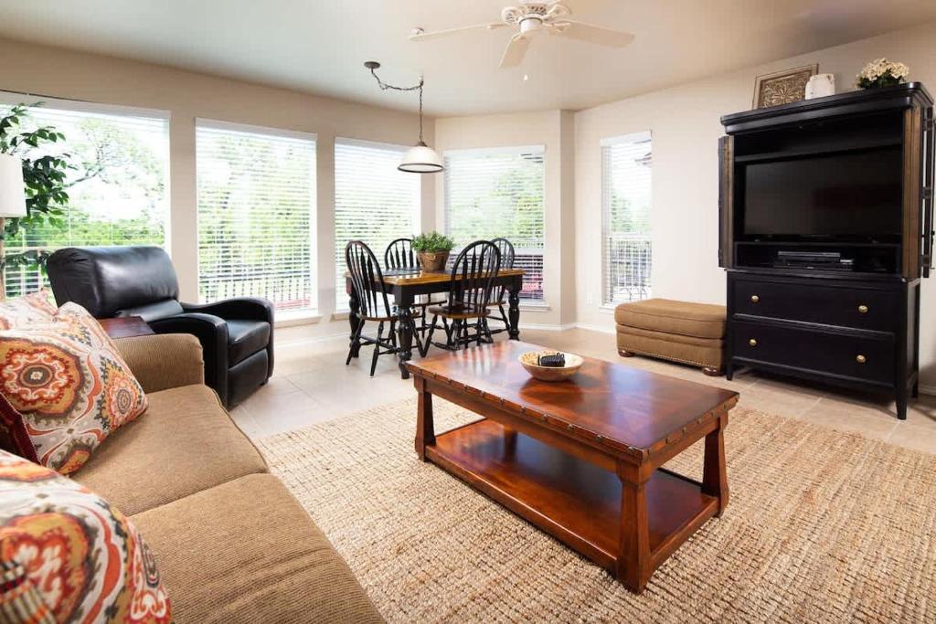 a living room with a couch and a coffee table at WW A302 River Relaxation in New Braunfels