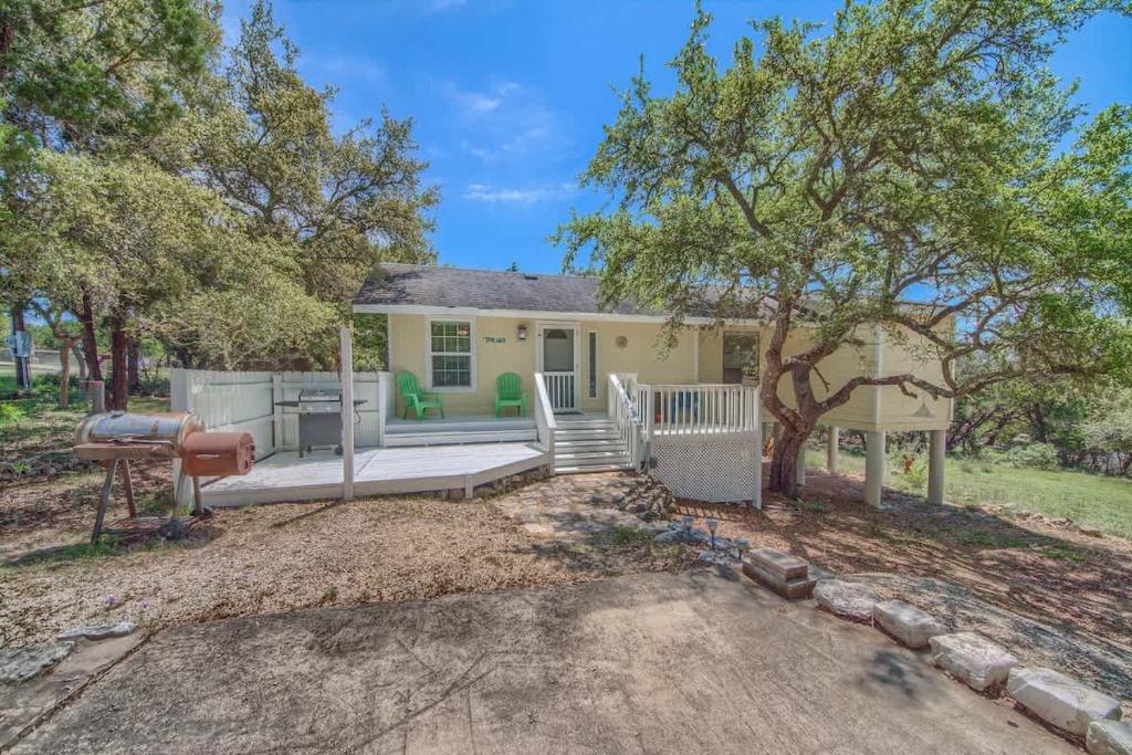 a house with a porch and a tree at CL 2459 Yellow Rose in Canyon Lake