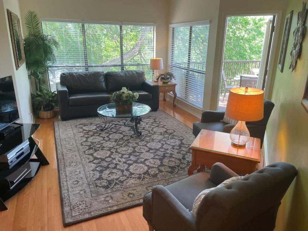 a living room with couches and a coffee table at IC 216 Inverness Condos Comal River in New Braunfels