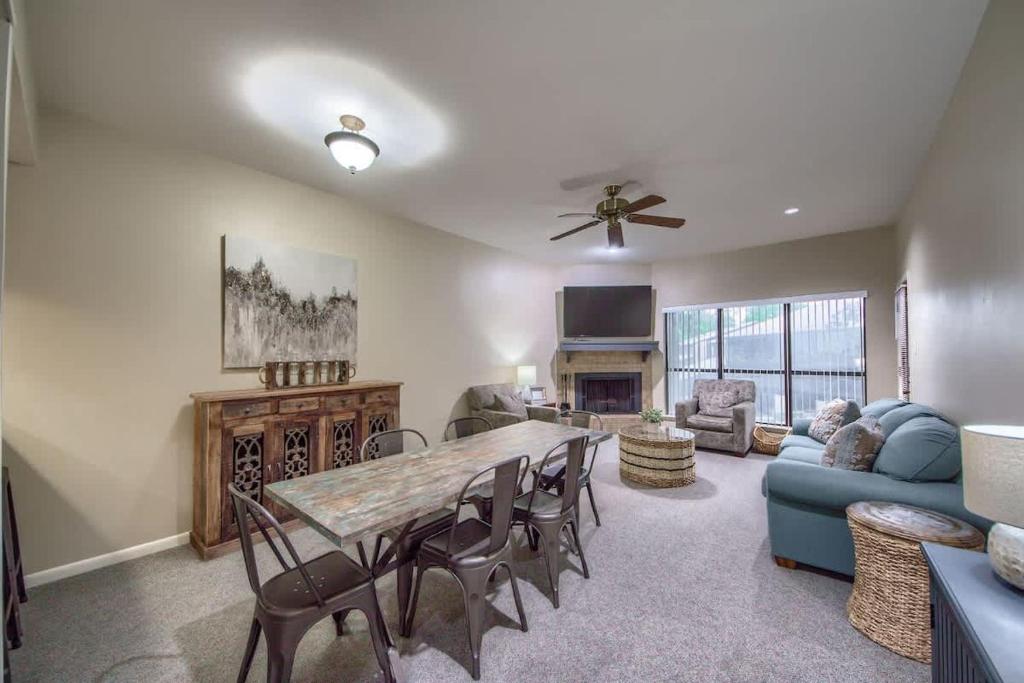 a living room with a table and chairs and a couch at CW B206 Rivers Edge in New Braunfels