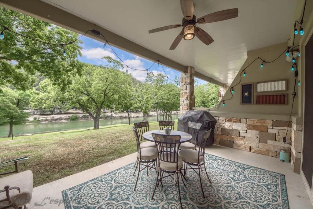a patio with a table and chairs on a porch at RG 105 Rio Refuge in Canyon Lake