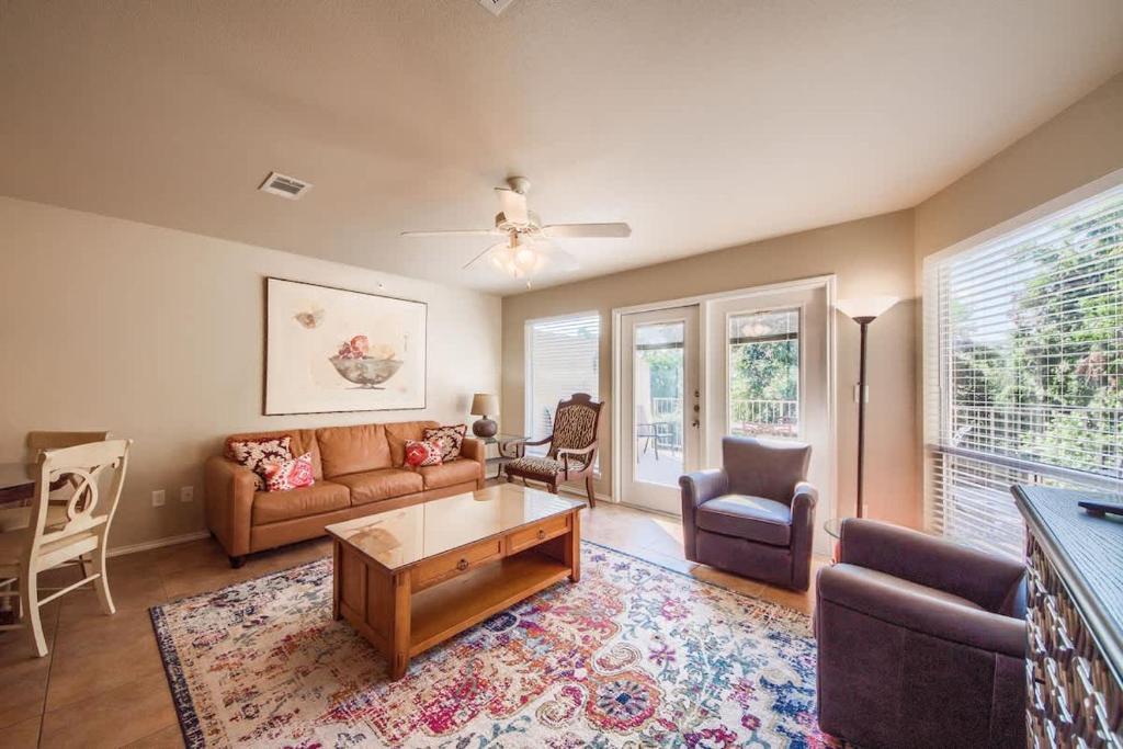 a living room with a couch and a table at WW H303 Dreams and Streams in New Braunfels