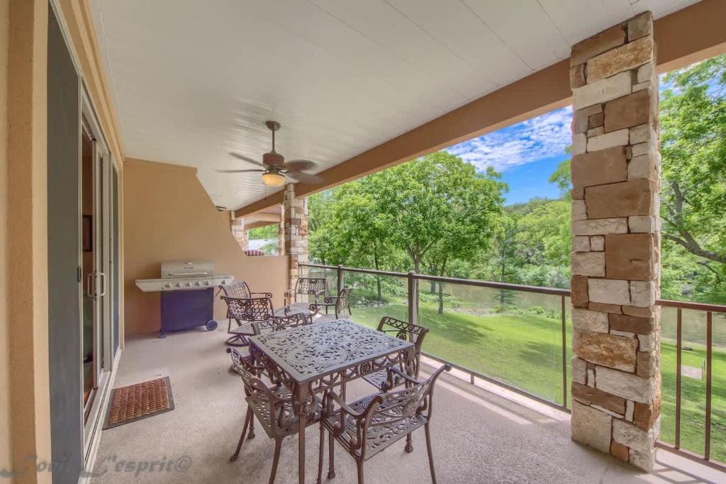 a patio with a table and chairs on a balcony at RG 203 Riverview Terrace in Canyon Lake