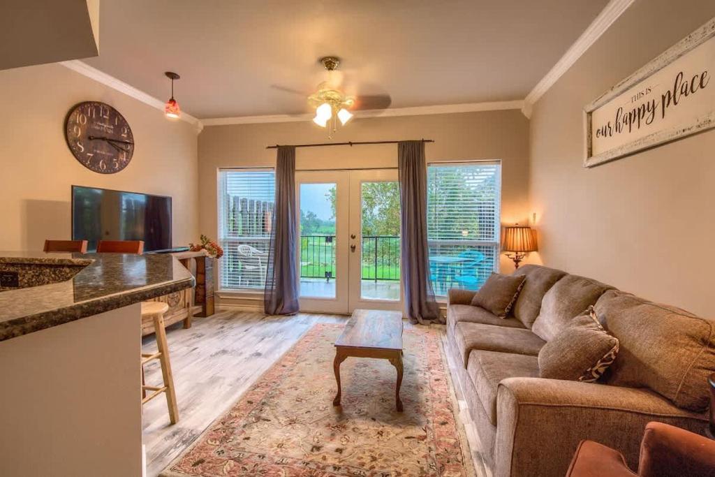 a living room with a couch and a table at SS B4 Riverside Condo in New Braunfels
