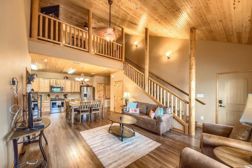a living room with a couch and a table at OM A14 Gruene Bridge Bungalow at Old Mills Resort in New Braunfels