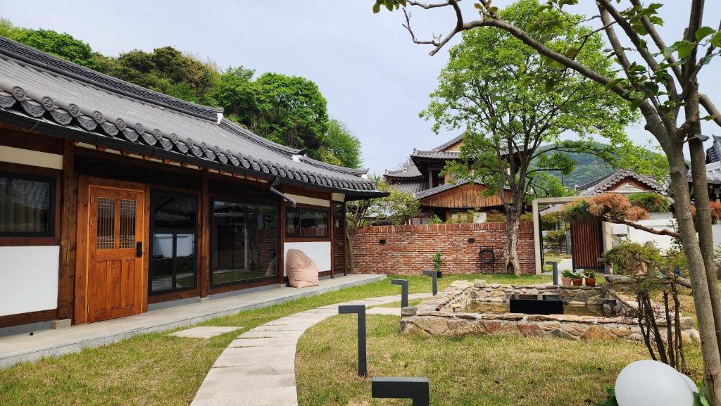 a building with a walkway in front of it at 전주한옥마을 자하연해랑 in Jeonju