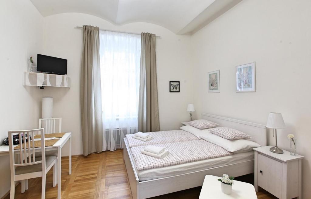 Postel nebo postele na pokoji v ubytování Angel City Aparthotel
