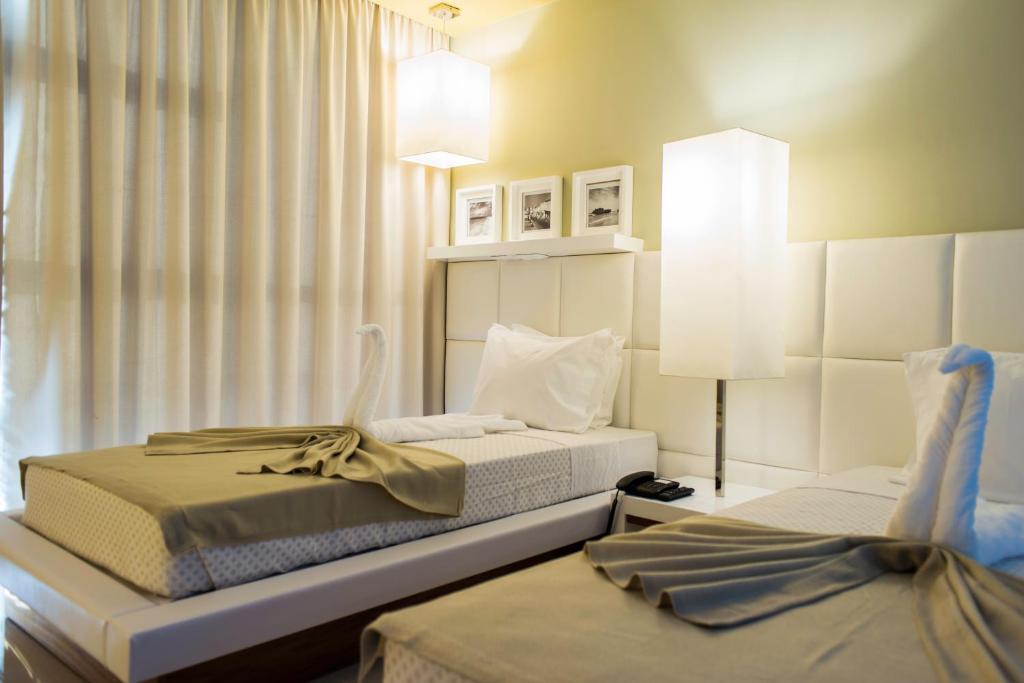 Postel nebo postele na pokoji v ubytování Hotel Vip Praia