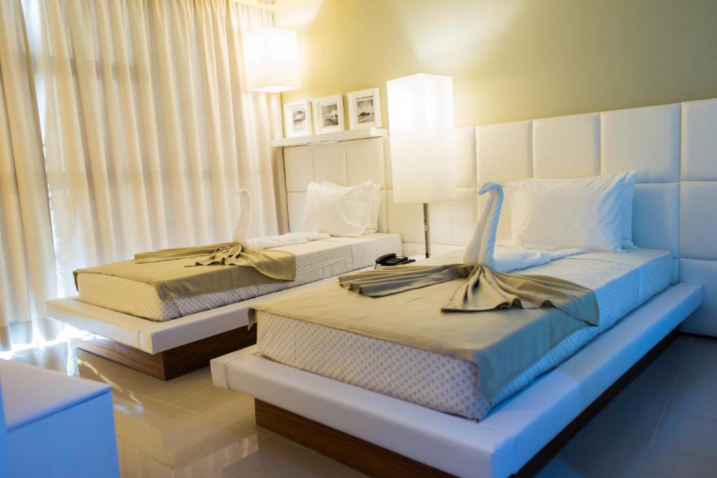 Postel nebo postele na pokoji v ubytování Hotel Vip Praia