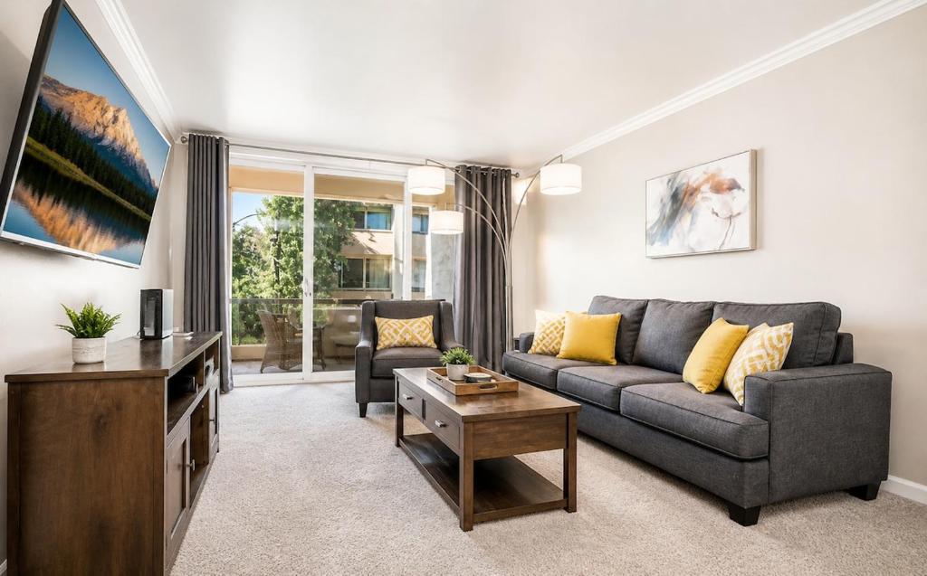 a living room with a couch and a table at Relaxing Condo with Parking - Minutes to Old Town! in Scottsdale