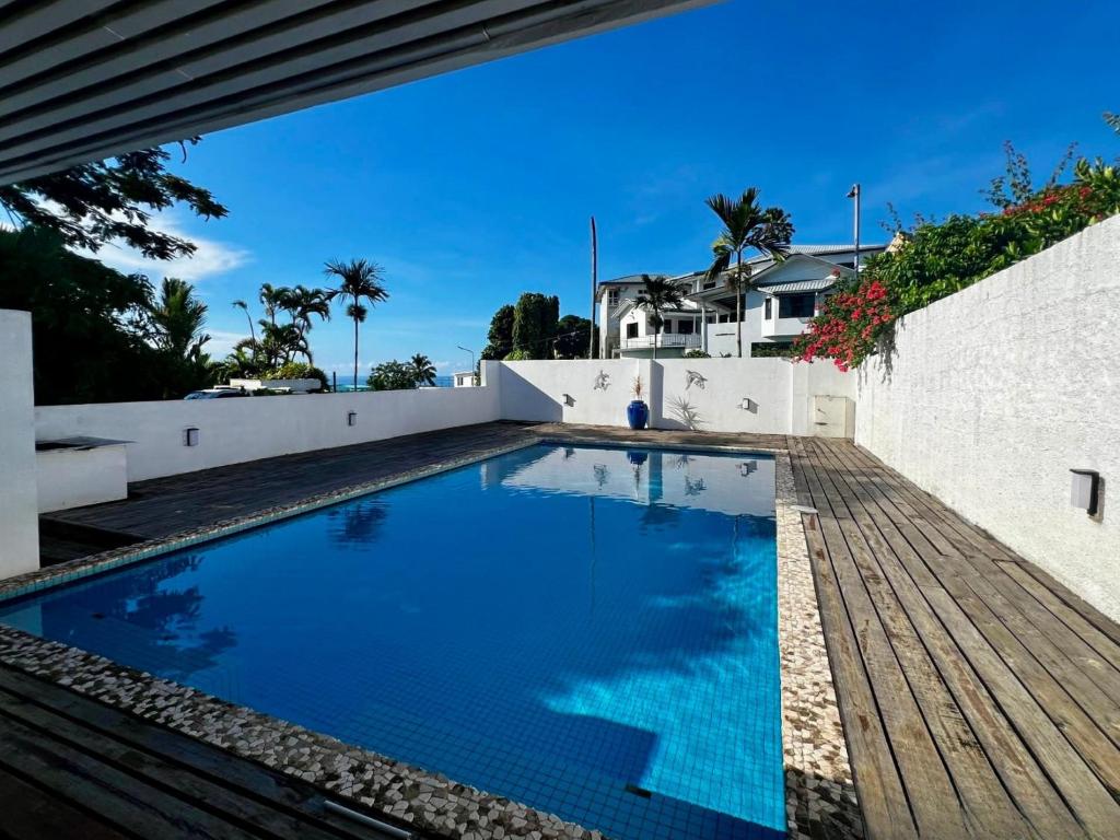 a swimming pool in the backyard of a house at 3BR Oceanview Villas - Raisara Retreat, Central Suva in Suva