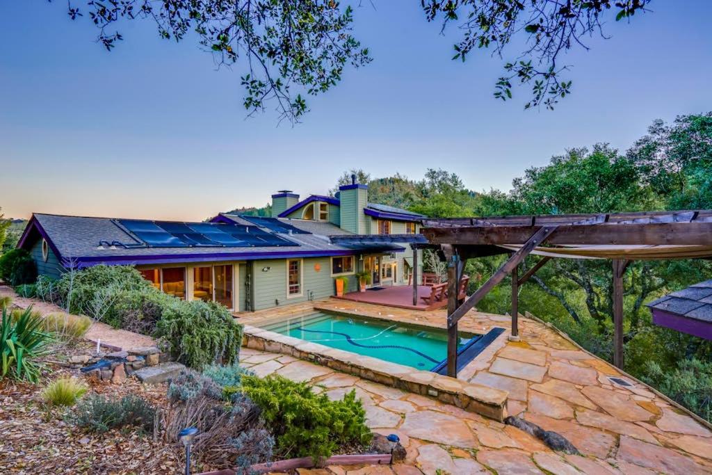 an exterior view of a house with a swimming pool at Leslie Creek House in Mark West Springs