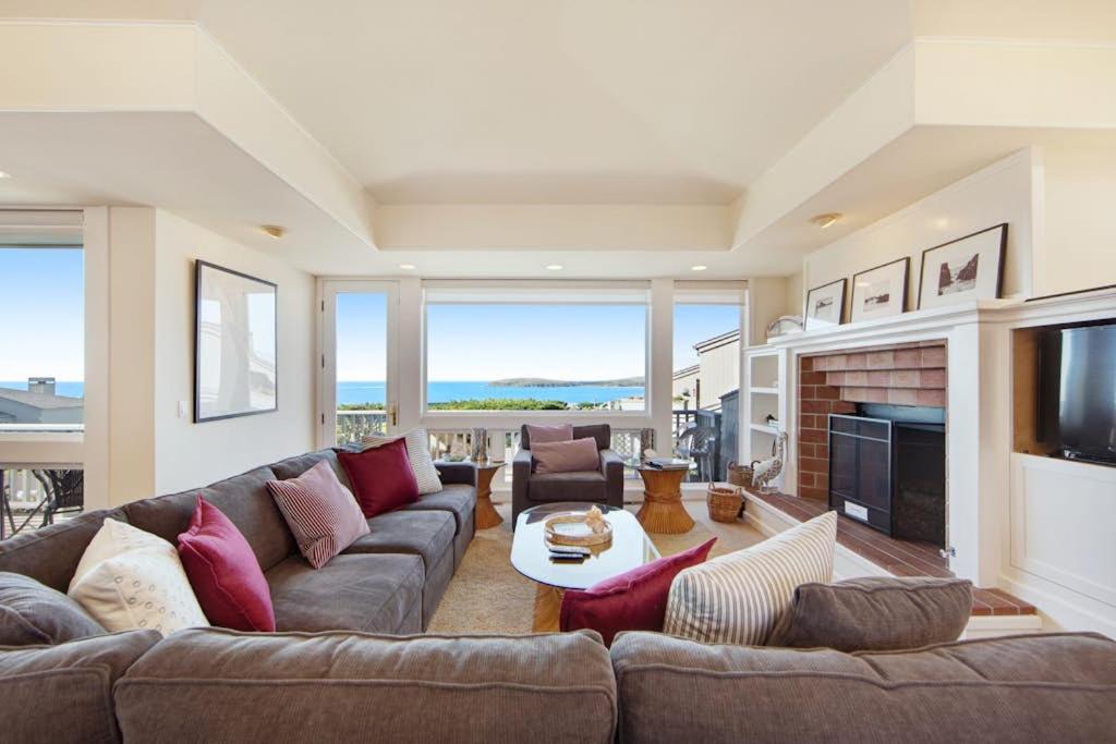a living room with a couch and a fireplace at Harbour House in Bodega Bay