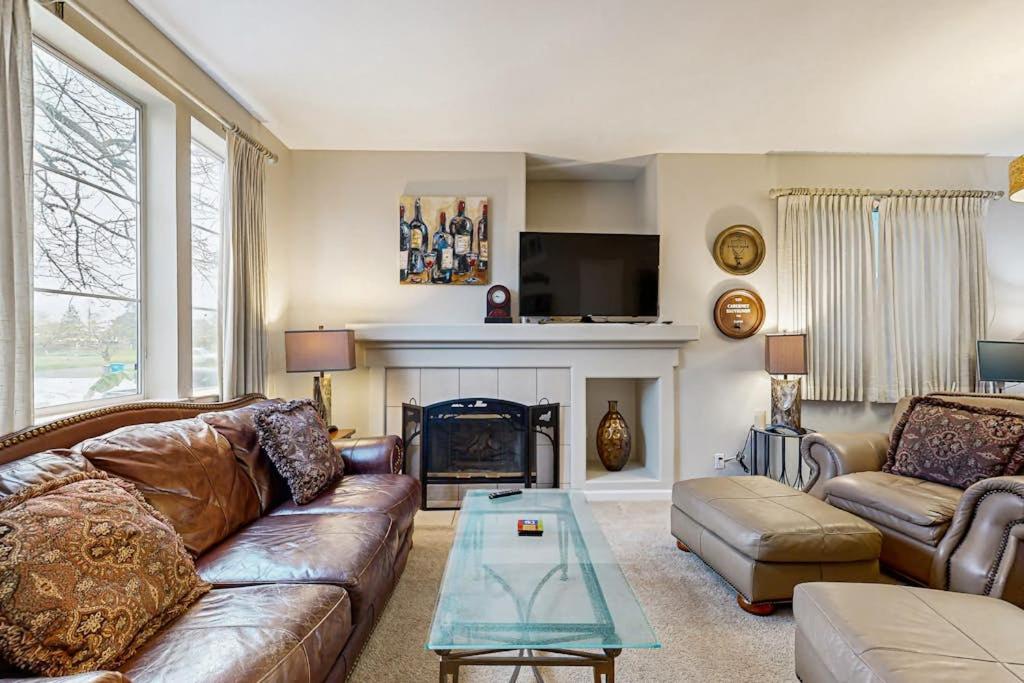 a living room with a couch and a fireplace at The Grape Escape in Santa Rosa