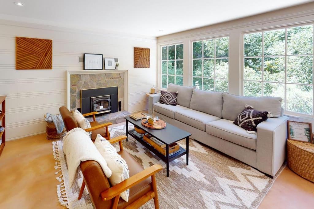 a living room with a couch and a fireplace at Hidden Acres Retreat in Guerneville
