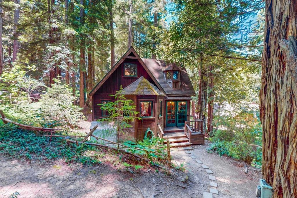 a small house in the middle of a forest at Dreamcatcher Cottage in Cazadero