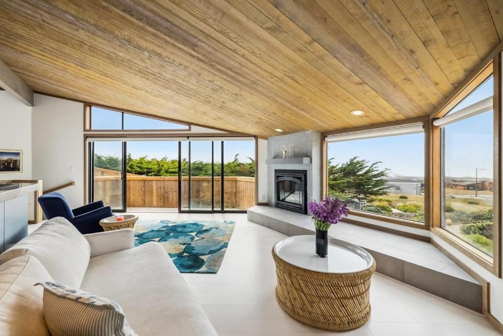 a living room with a couch and a fireplace at Mar Vista in Bodega Bay