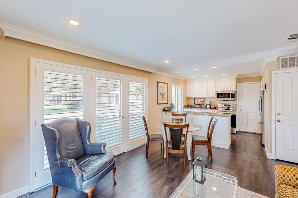 a living room with a table and chairs and a kitchen at Silverado Resort and Spa 381 & 382 in Napa