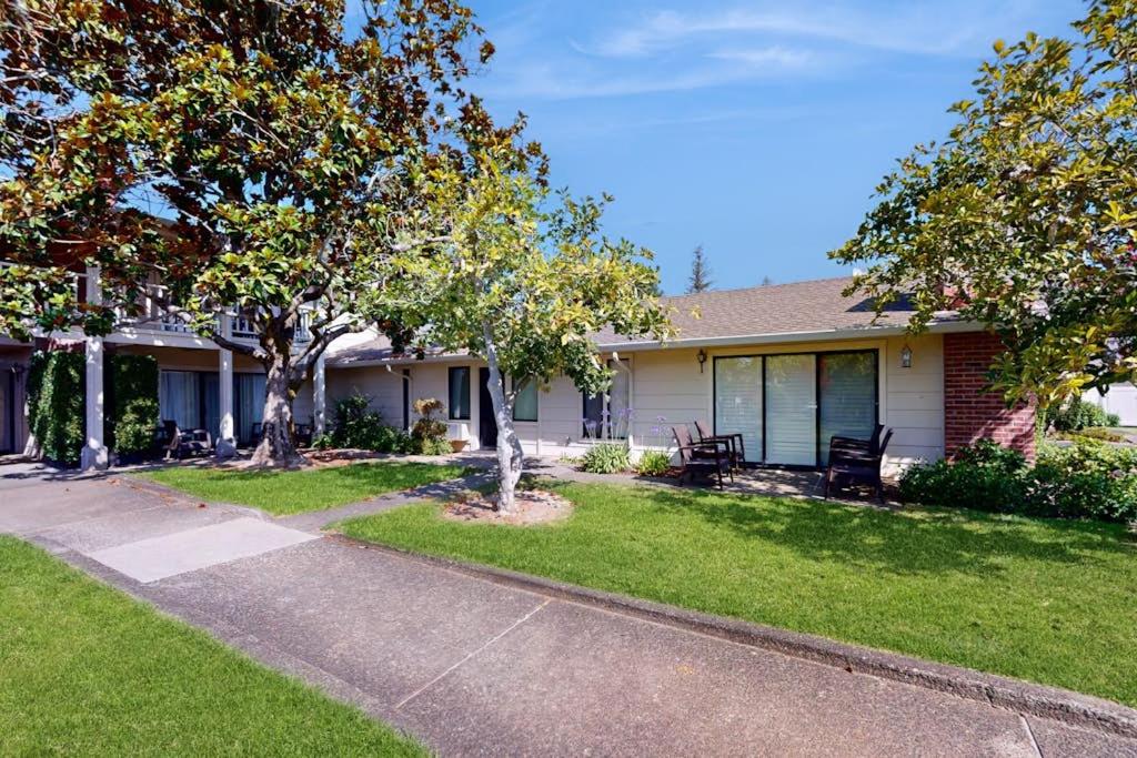 a house with a yard with trees and a driveway at Silverado Resort and Spa 288 in Napa