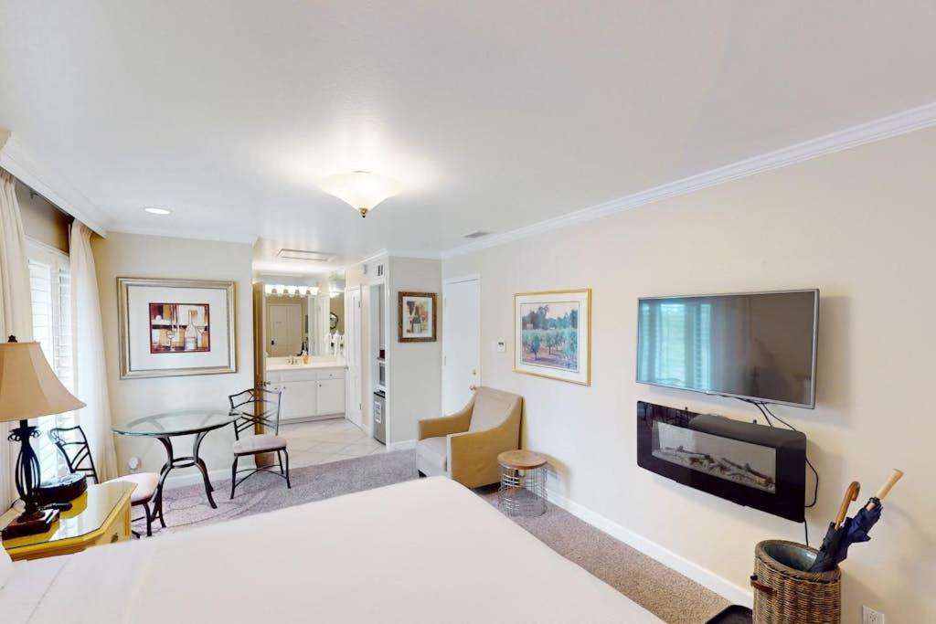a bedroom with a large bed and a tv on a wall at Silverado Resort and Spa 267 in Napa