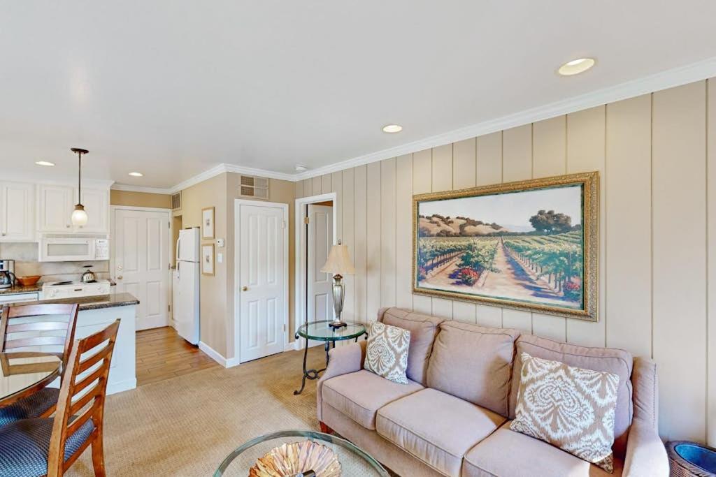 a living room with a couch and a kitchen at Silverado Resort and Spa 287 in Napa