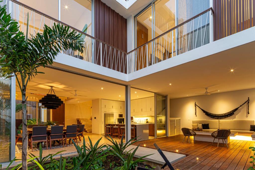 an open living room and dining area of a house at Casa del Paseo Luxury Home in Centro Rooftop Bar & 2 Pools in Mérida