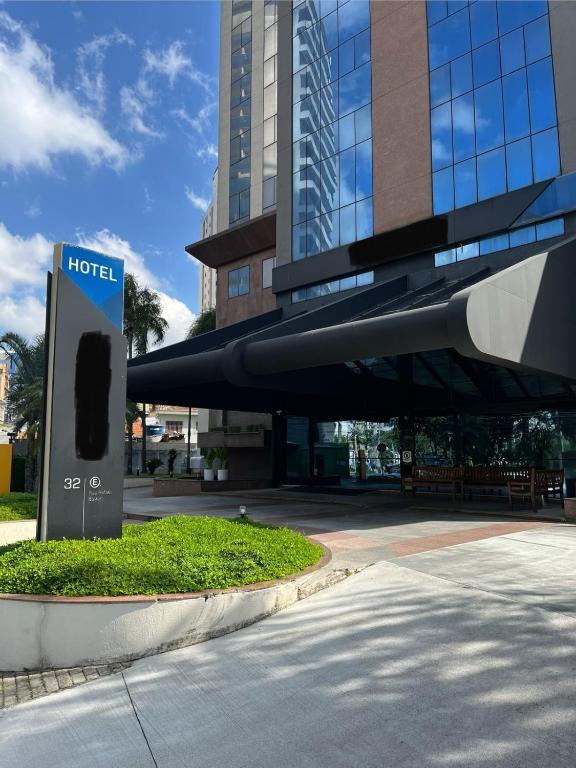a hotel sign in front of a building at Hotel Flat Guarulhos Apto1411 in Guarulhos