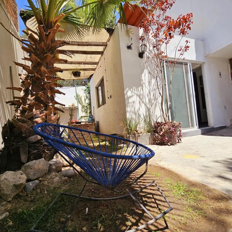 a blue basket sitting in front of a house at Isabella's Cottage in Cholula