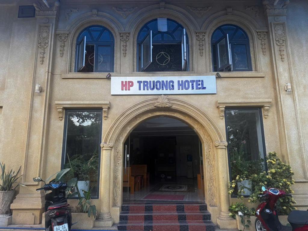 a building with a h flipping motel sign on it at HP Truong Hotel Phu Quoc in Phú Quốc