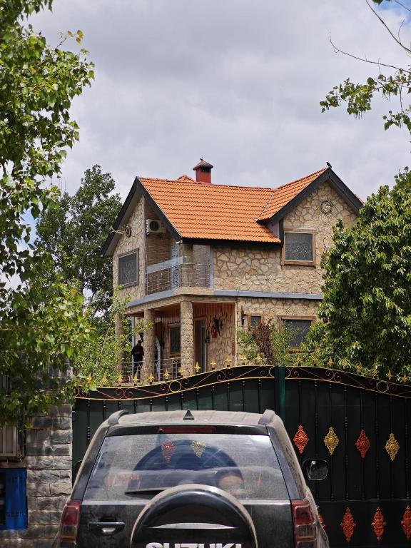 a car parked in front of a house at Le Coin Nature in Azrou