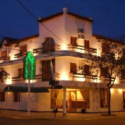 a building with a green sign in front of it at Salta Hotel in Venado Tuerto