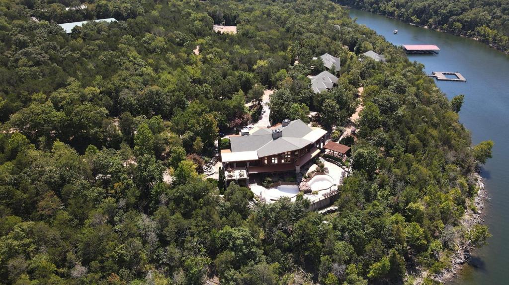 an aerial view of a house on an island in the water at Hilton Grand Vacations Club Stonewater Cove Shell Knob in Shell Knob