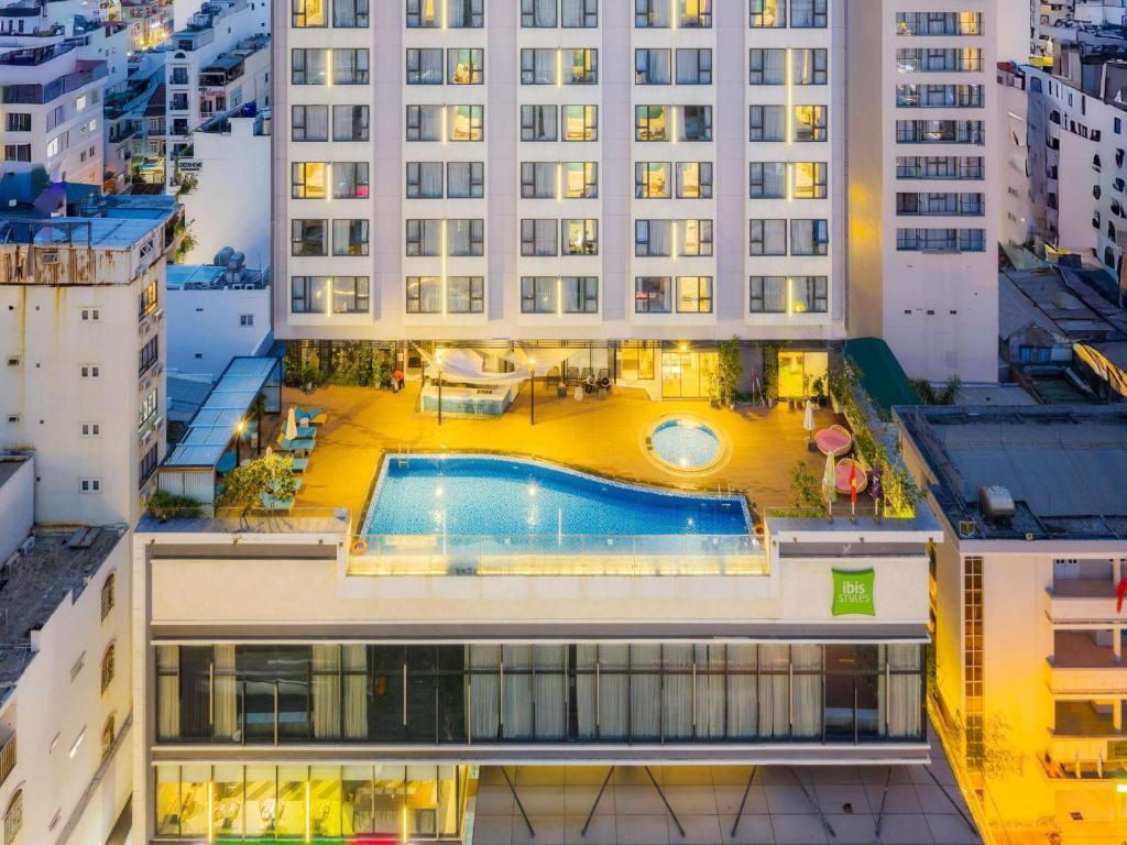an overhead view of a building with a swimming pool at ibis Styles Nha Trang in Nha Trang