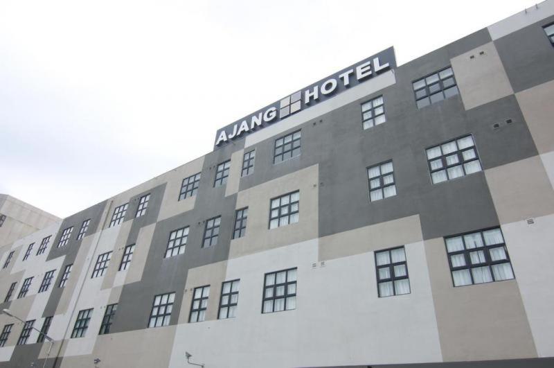 a large building with an amazonartment sign on it at Ajang Hotel in Miri