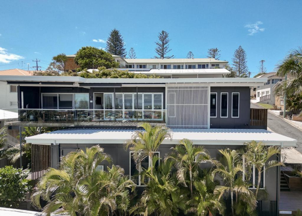 an aerial view of a house with palm trees at Bay Properties The Big Chill in Yamba