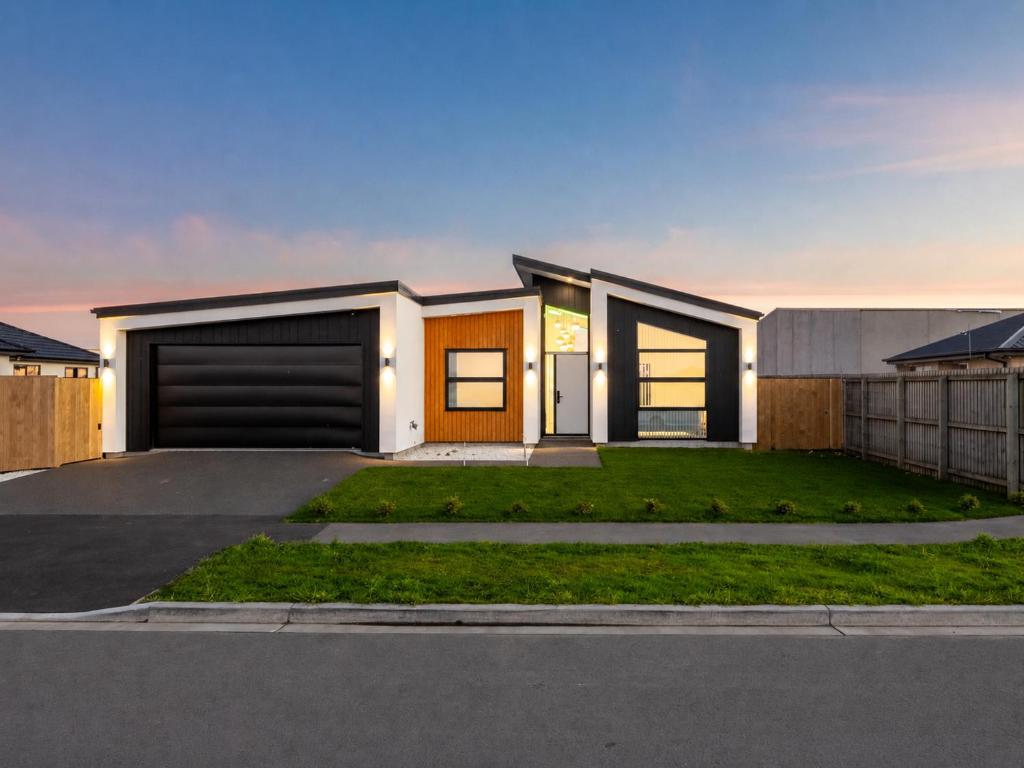 a modern house with a driveway at The Gem - 5 bedroom brand new house in Christchurch