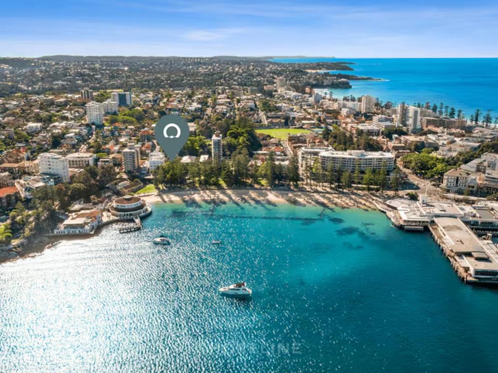 an aerial view of a beach with a city at Manly Beachfront Stays - 3 Bedroom with Garden - Steps to Ferry, Beach, Shops & Restaurants in Sydney