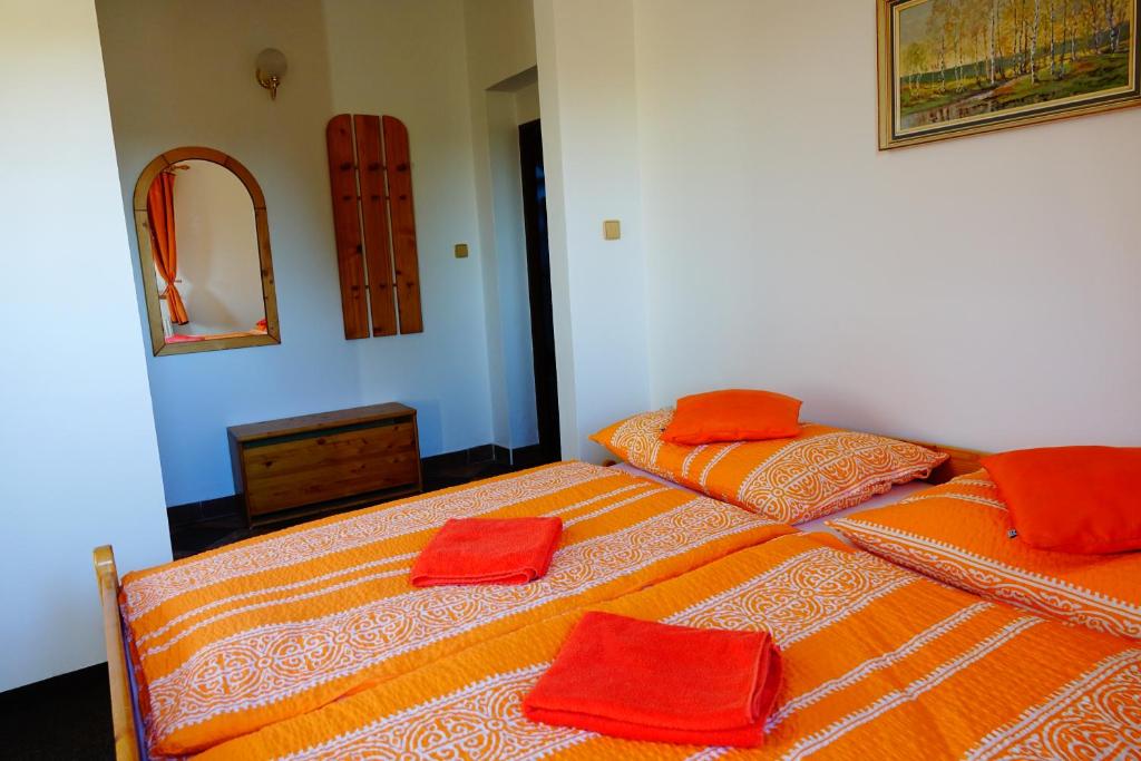A bed or beds in a room at Penzion U Studánky