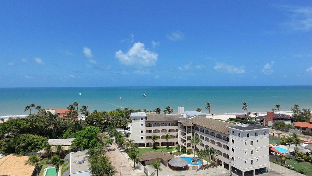an aerial view of a hotel and the beach at Hosts BR - La Serena Suíte Cumbuco in Caucaia